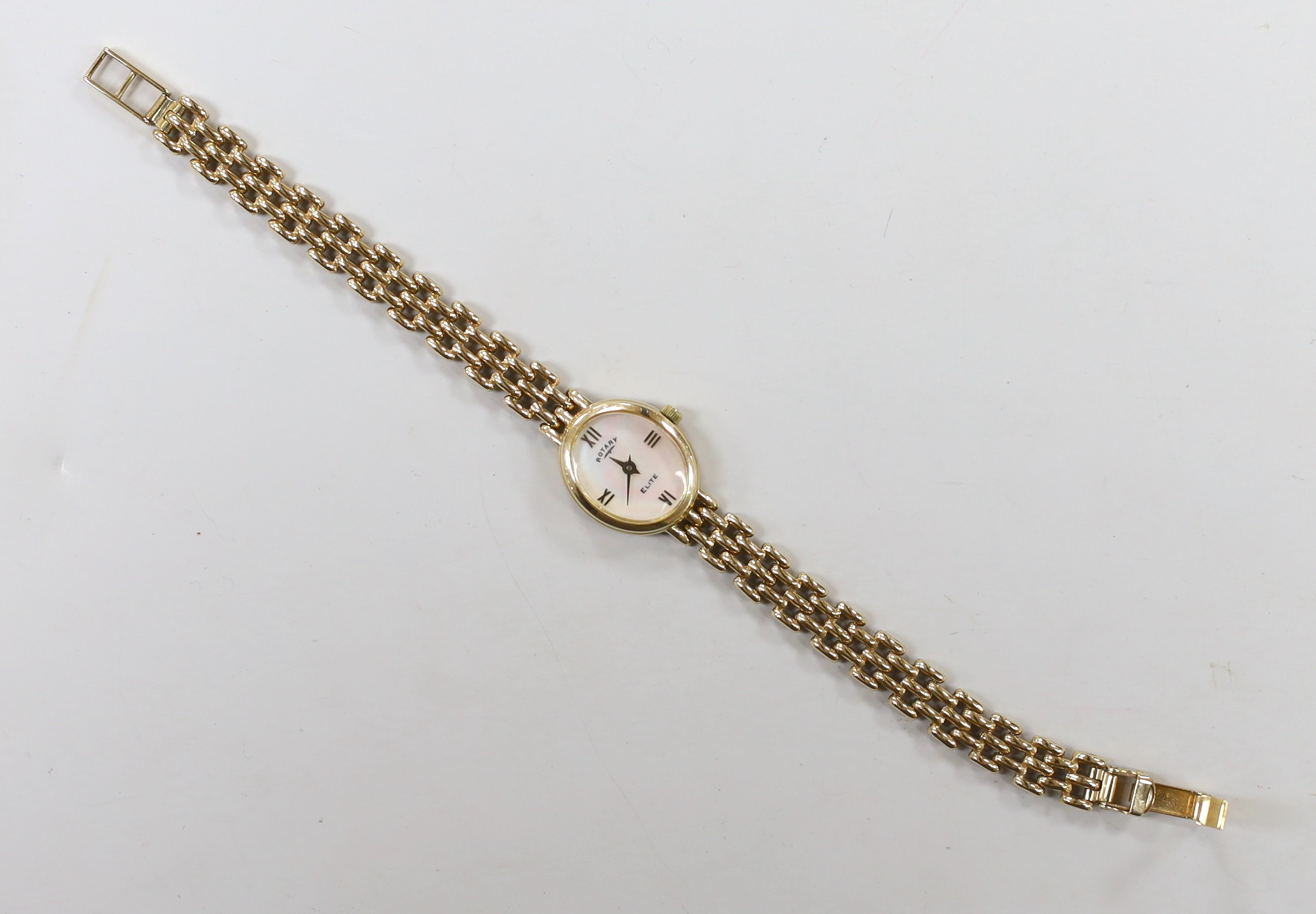 A lady's modern 9k Rotary Elite oval dial quartz wrist watch, on a 375 bracelet, overall 18cm, gross 15.4 grams.